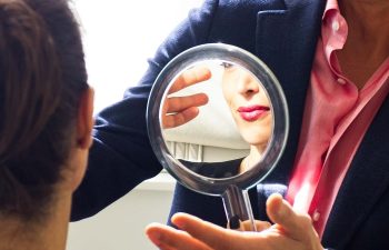 a patient looking into a mirror