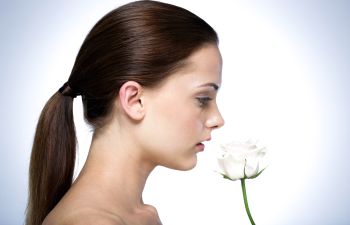 Woman Smelling Flower