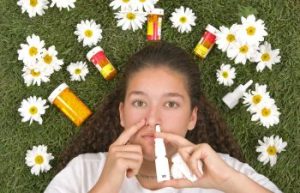 Woman using nose spray.